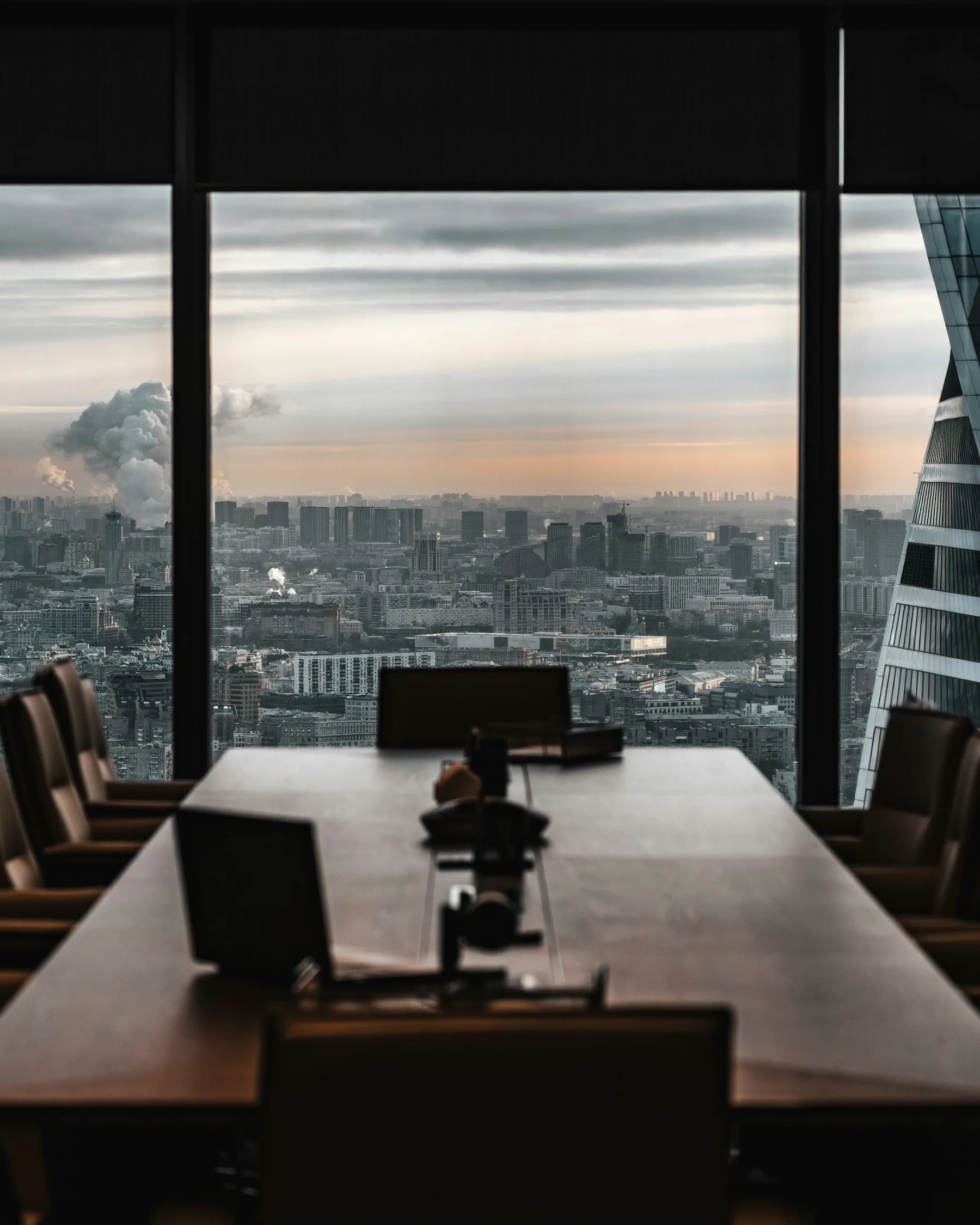 Conference room overlooking a city skyline.